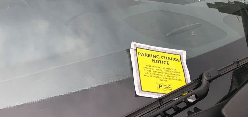 parking charge notice on a car windscreen
