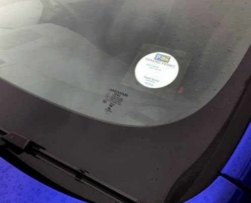 A permit being displayed in a vehicle windscreen